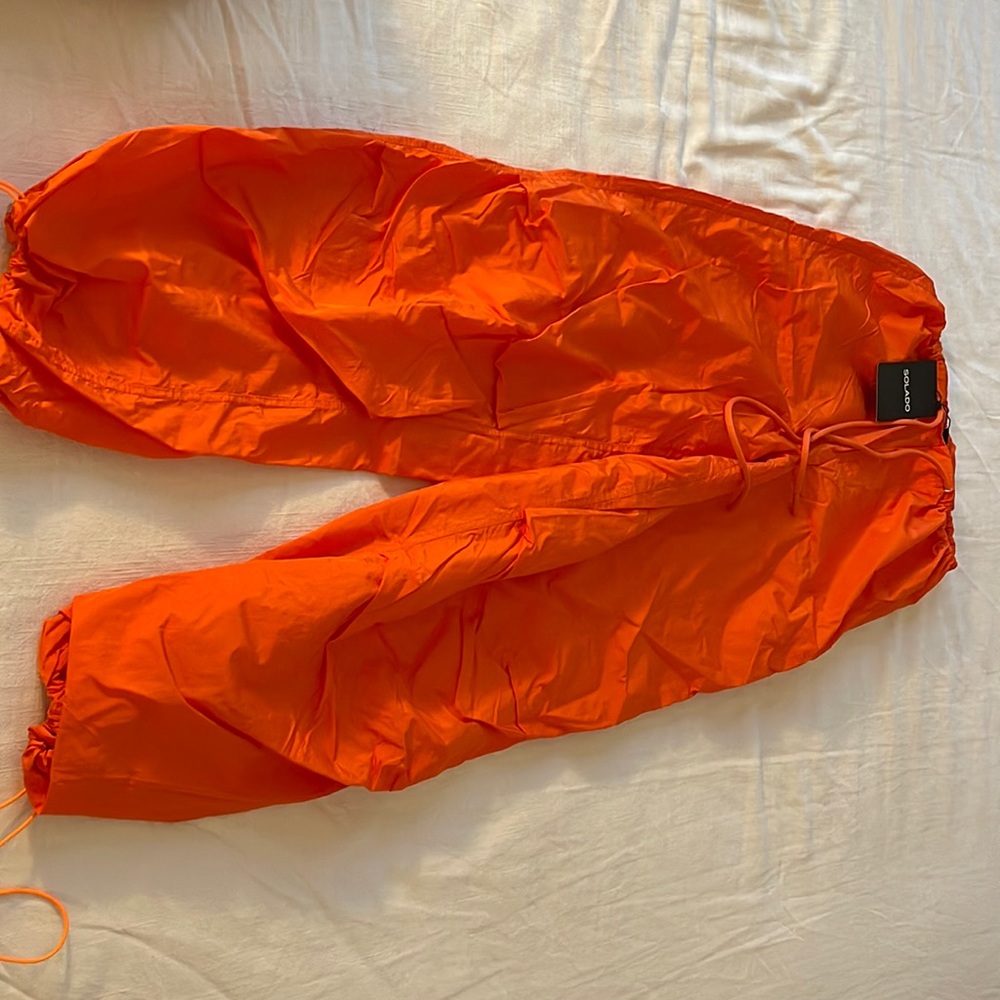 SOLADO Low Waist Drawstring Hem Solid Parachute Pants
